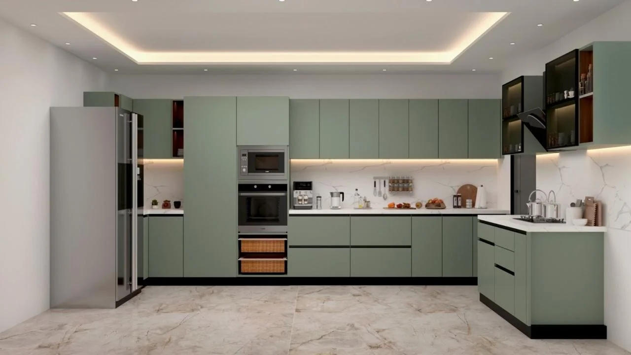 Sage green kitchen with integrated appliances and marble surfaces